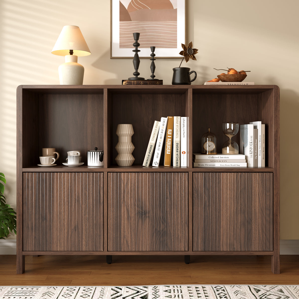 Walnut fluted 3-door storage cabinet with open shelves displaying books and home decor - Elirian