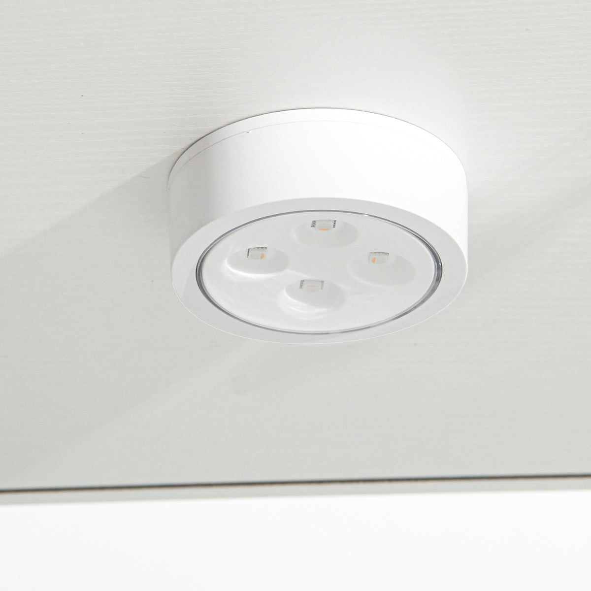 Modern white LED ceiling light fixture with four warm lights mounted on ceiling - Elirian