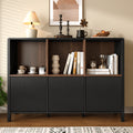 Black fluted storage cabinet with open shelves displaying books and decorative home accessories - Elirian