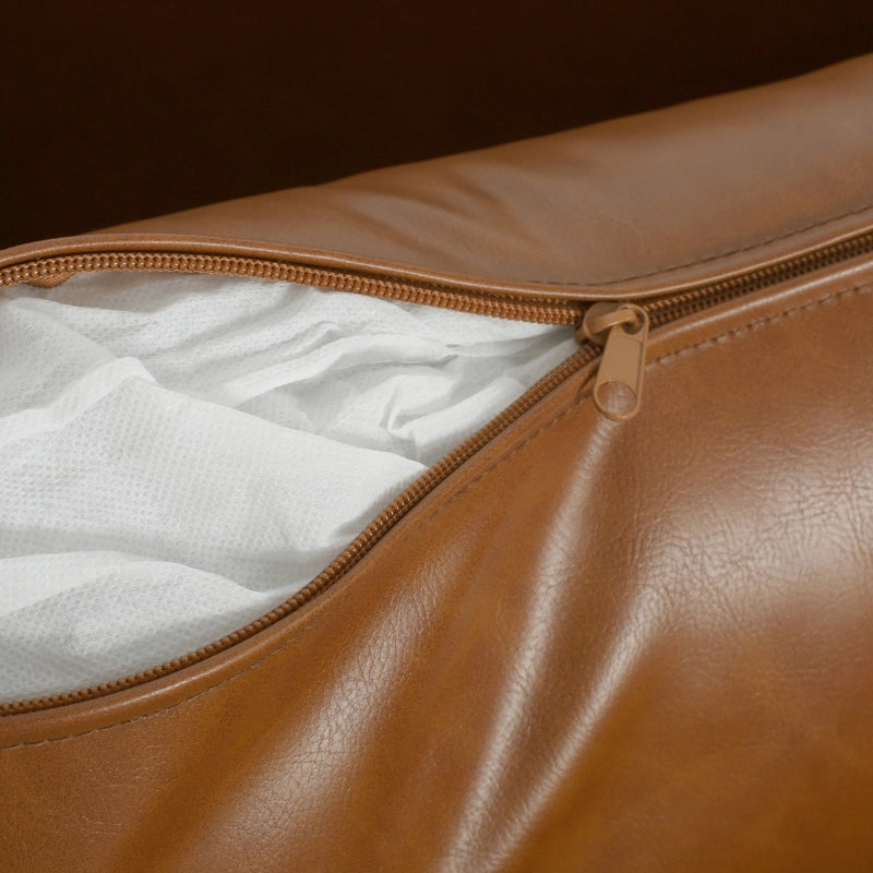 Vintage brown faux leather lounge chair interior detail showing white cushioned interior - Elirian