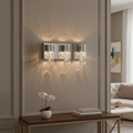 Modern chrome LED vanity light with seeded glass shades casting ambient bathroom lighting - Elirian