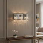 Modern chrome LED vanity light with seeded glass shades casting ambient bathroom lighting - Elirian