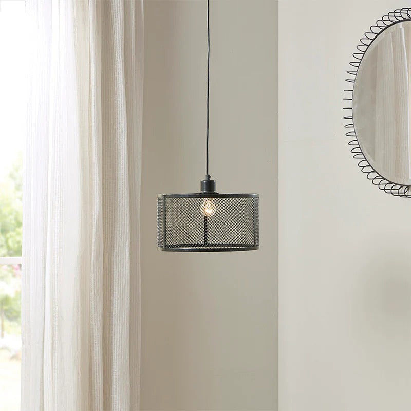 Black drum mesh metal pendant light with adjustable cord above white curtains - Elirian