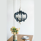 Blue wood and iron farmhouse pendant light with scrolled arms and glass shades - Elirian