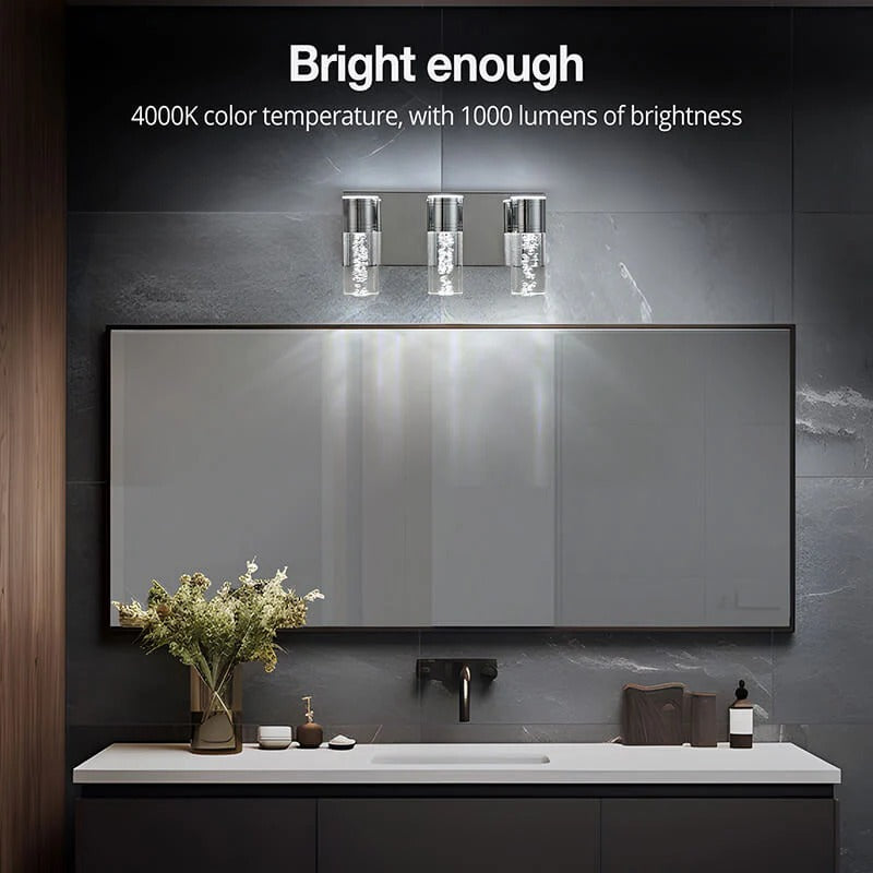 Modern silver LED bathroom vanity light with seeded glass shade above marble sink - Elirian