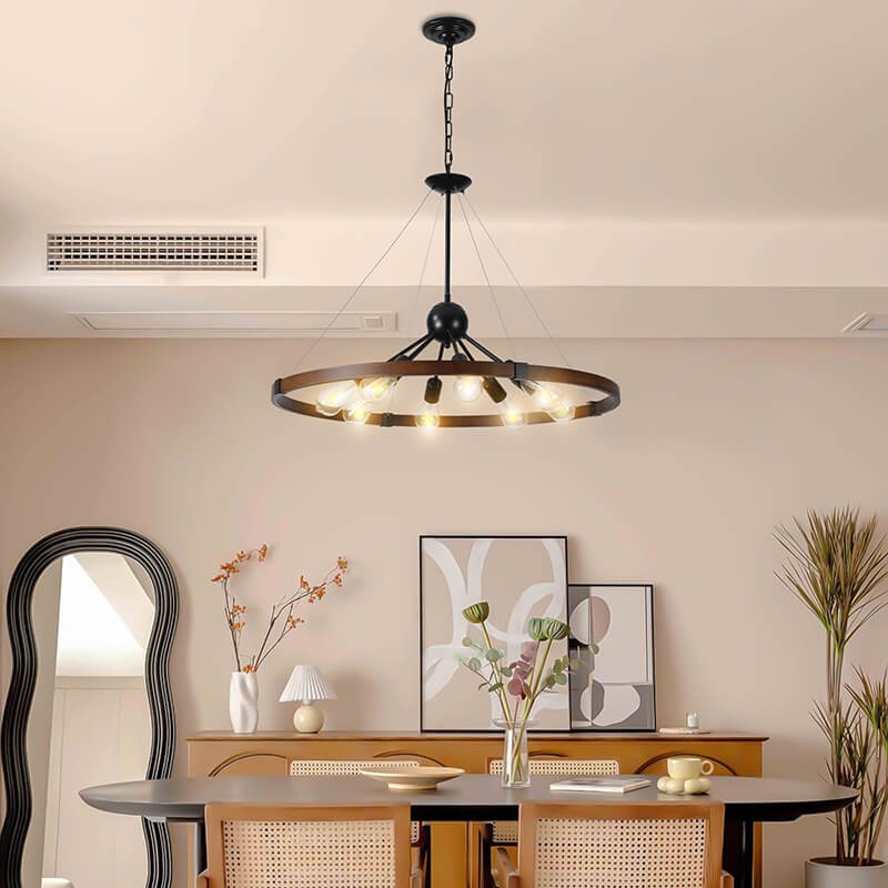 Walnut and black farmhouse 8-light wagon wheel pendant fixture over dining space - Elirian