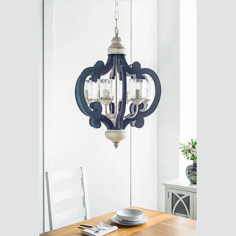 Blue wood and iron farmhouse pendant light with scrolled arms and glass shades - Elirian