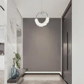 Modern crystal glass LED pendant light with chrome finish illuminating contemporary bathroom - Elirian