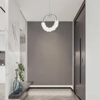 Modern crystal glass LED pendant light with chrome finish illuminating contemporary bathroom - Elirian