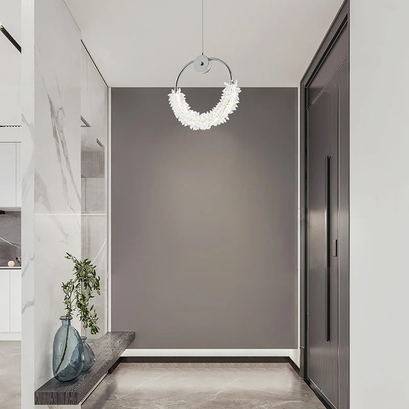 Modern crystal glass LED pendant light with chrome finish illuminating contemporary bathroom - Elirian