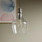 Bell Glass Pendant Light - Matte black metal fixture with clear glass shade and adjustable cord - Elirian