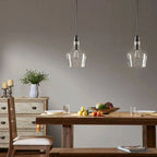 Bell Glass Pendant Light - Modern matte black fixtures illuminate dining table - Elirian