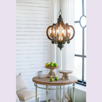 French 6-Light Black Country Wood Pendant Light - Ornate rustic chandelier over round wooden table - Elirian