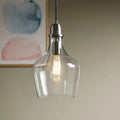 Bell Glass Pendant Light - Clear glass shade with warm filament bulb, polished chrome fixture - Elirian