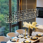 Modern champagne gold oval crystal pendant light fixture with geometric metal frame - Elirian