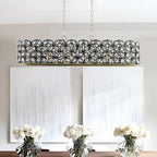 Modern Champagne Gold Oval Crystal Pendant Light - contemporary chandelier over white flowers - Elirian