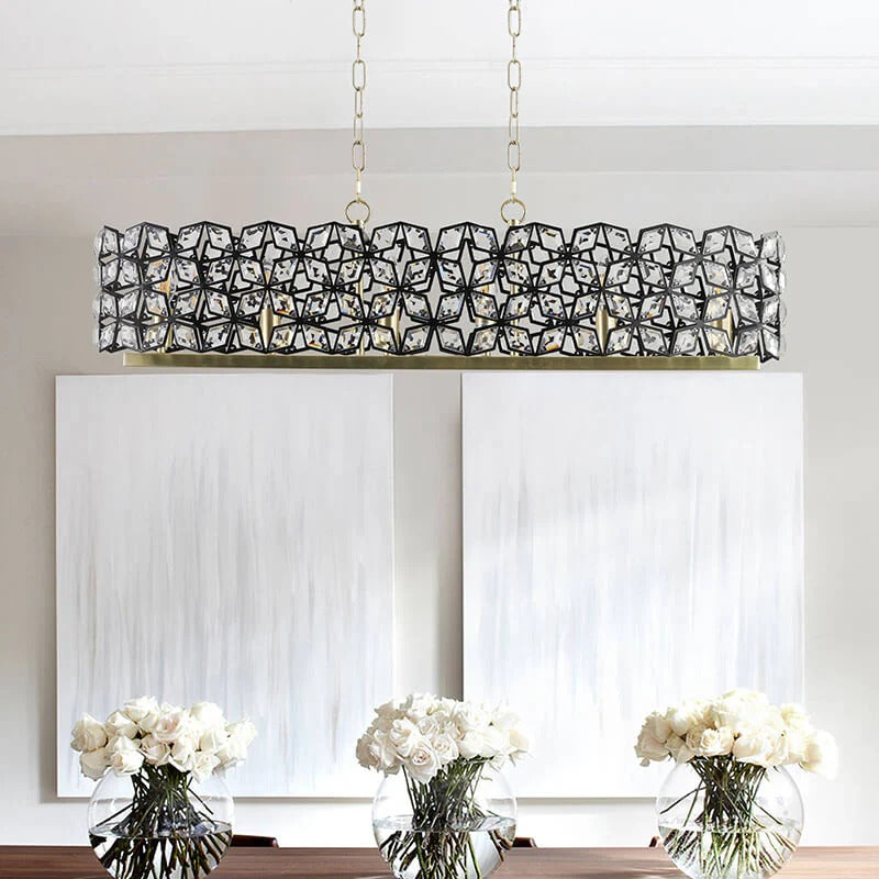 Modern Champagne Gold Oval Crystal Pendant Light - contemporary chandelier over white flowers - Elirian