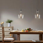 Bell Glass Pendant Light Matte Black - Modern dining room lighting fixture over wooden table - Elirian