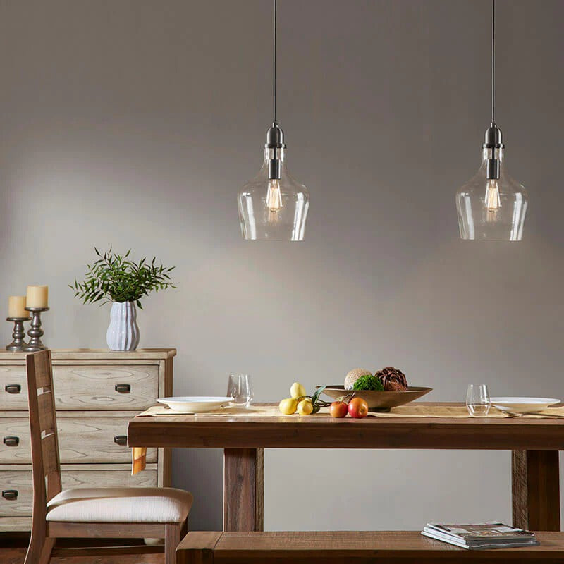 Bell Glass Pendant Light Matte Black - Modern dining room lighting fixture over wooden table - Elirian