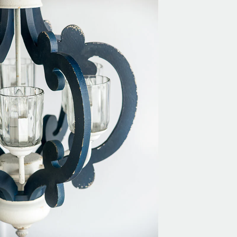 Blue farmhouse pendant light with scrolled iron arms and glass shades - Elirian