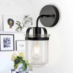 Modern black wall sconce with clear glass shade, contemporary lighting fixture - Elirian