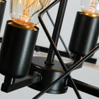 Modern farmhouse four-light pendant fixture with black metal frame and warm oak accents - Elirian