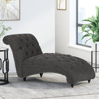 Fauteuil lounge moderne anthracite capitonné aux formes arrondies avec surpiqûres en losange