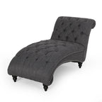 Fauteuil lounge moderne anthracite capitonné aux formes arrondies avec surpiqûres en losange