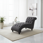 Fauteuil lounge moderne anthracite capitonné aux formes arrondies avec surpiqûres en losange