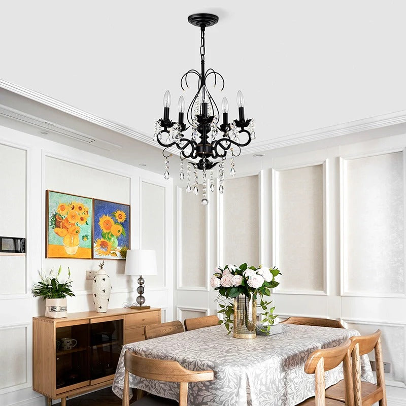 Black crystal chandelier pendant light hanging above wooden dining table in modern kitchen - Elirian