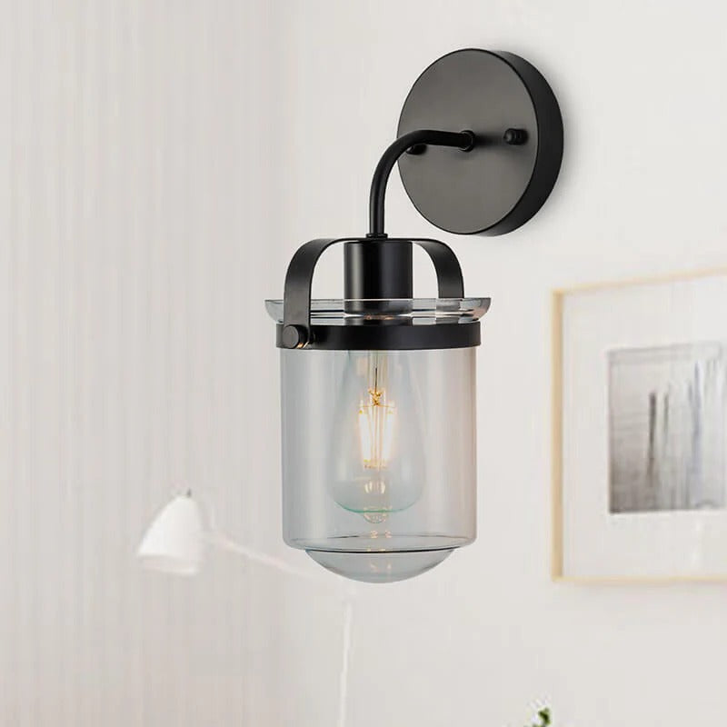 Modern black wall sconce with clear glass shade and adjustable arm - Elirian