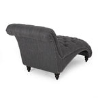 Fauteuil lounge moderne anthracite capitonné aux formes arrondies avec surpiqûres en losange