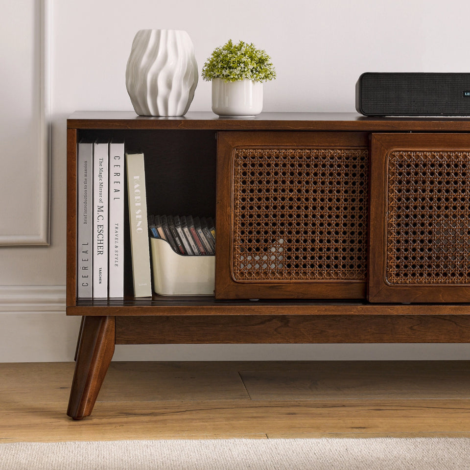 Mid-century modern walnut TV stand with rattan doors and open shelving storage - Elirian
