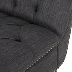 Fauteuil lounge moderne anthracite capitonné aux formes arrondies avec surpiqûres en losange