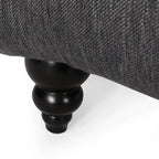 Fauteuil lounge moderne anthracite capitonné aux formes arrondies avec surpiqûres en losange