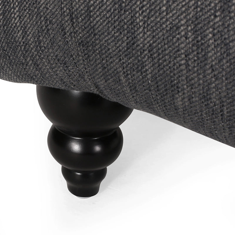 Fauteuil lounge moderne anthracite capitonné aux formes arrondies avec surpiqûres en losange