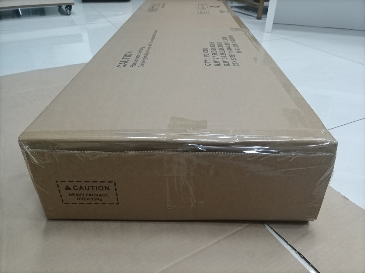 Sealed cardboard shipping box with caution heavy package label - Elirian furniture delivery - Elirian
