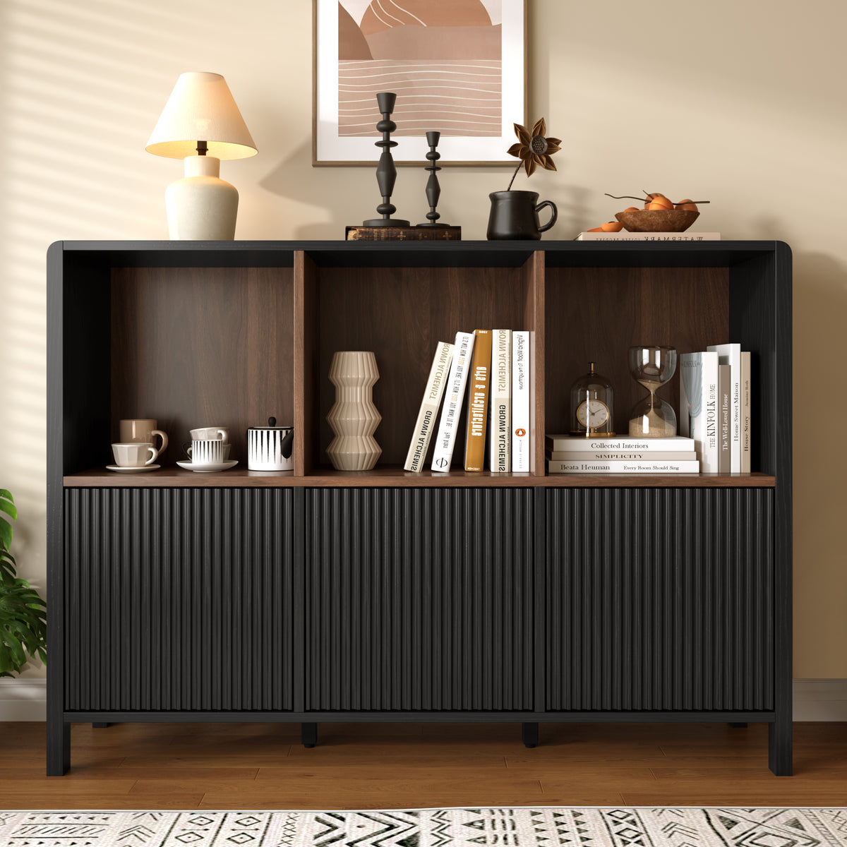 Black fluted 3-door storage cabinet with open shelves displaying books and decor - Elirian